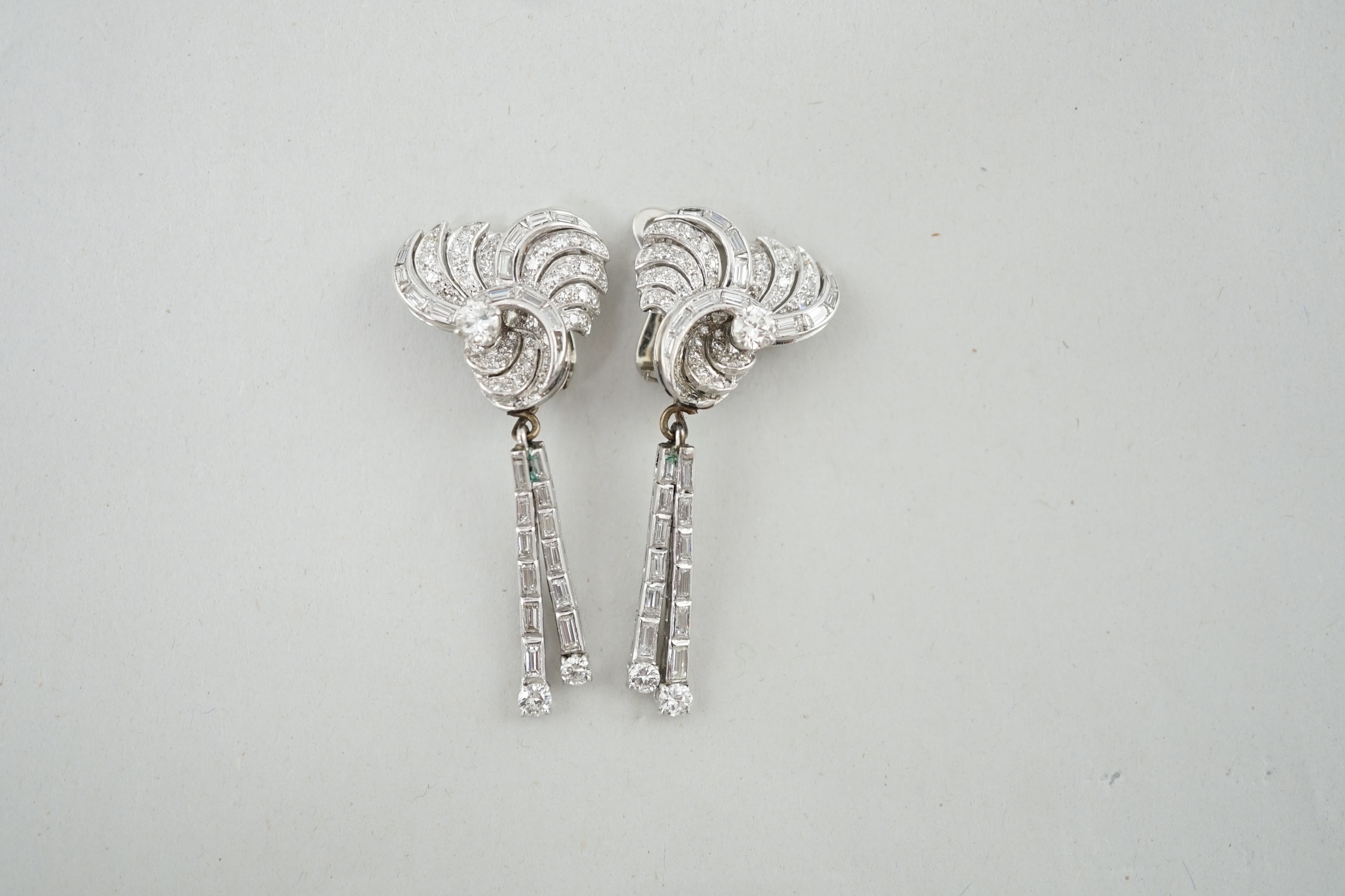 A pair of 1960's white gold and diamond cluster set drop ear clips